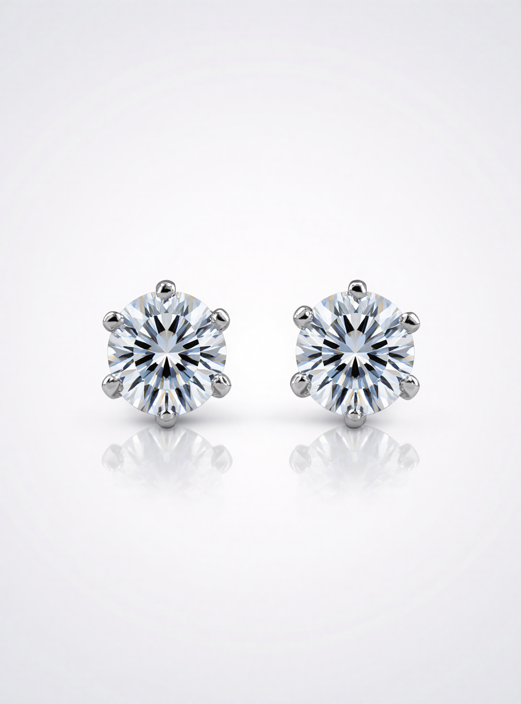 Pair of moissanite stud earrings on a white background