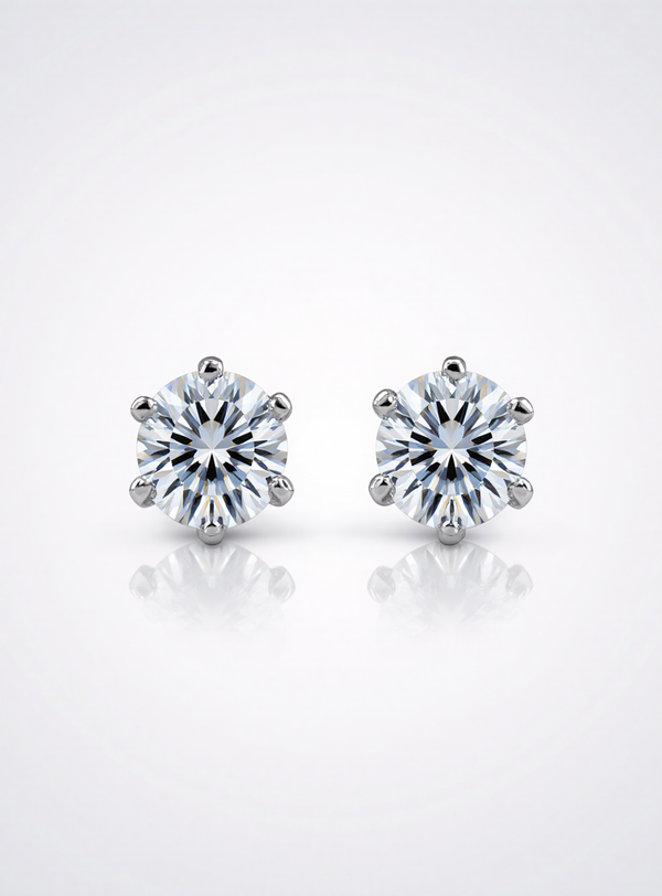 Pair of moissanite stud earrings on a white background