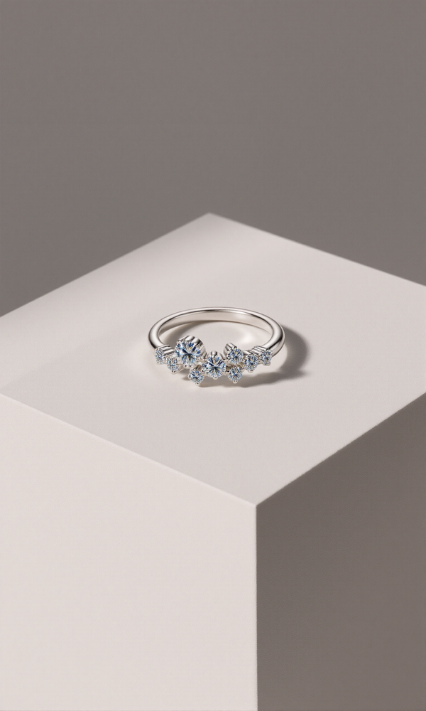 Silver ring with gemstones on a geometric gray and white background