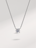 moissanite necklace on a light gray background