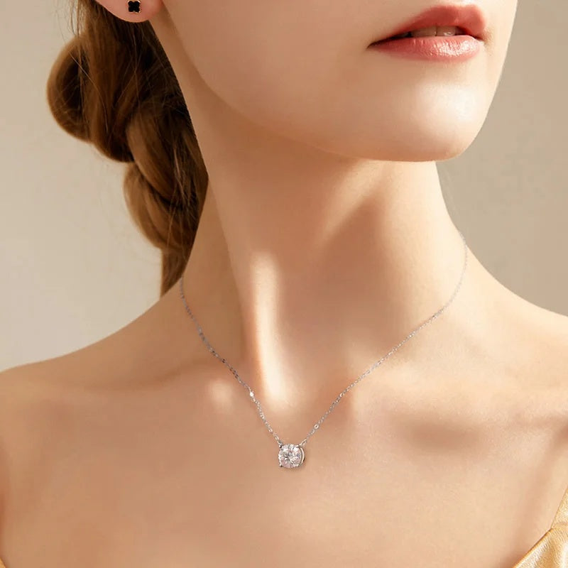 Necklace with a pendant on a model against a neutral background