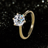 Gold ring with a large moissanite on a black background